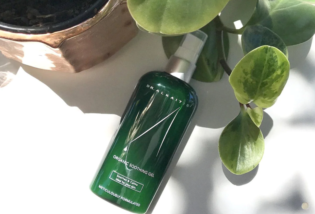 Dr. Alkaitis Organic Soothing Gel beside a houseplant