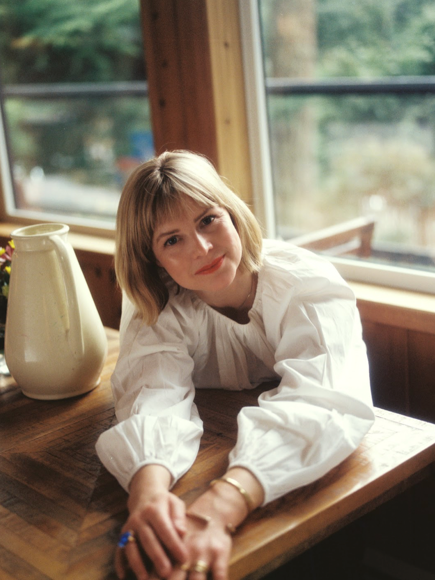 woman leaning over table