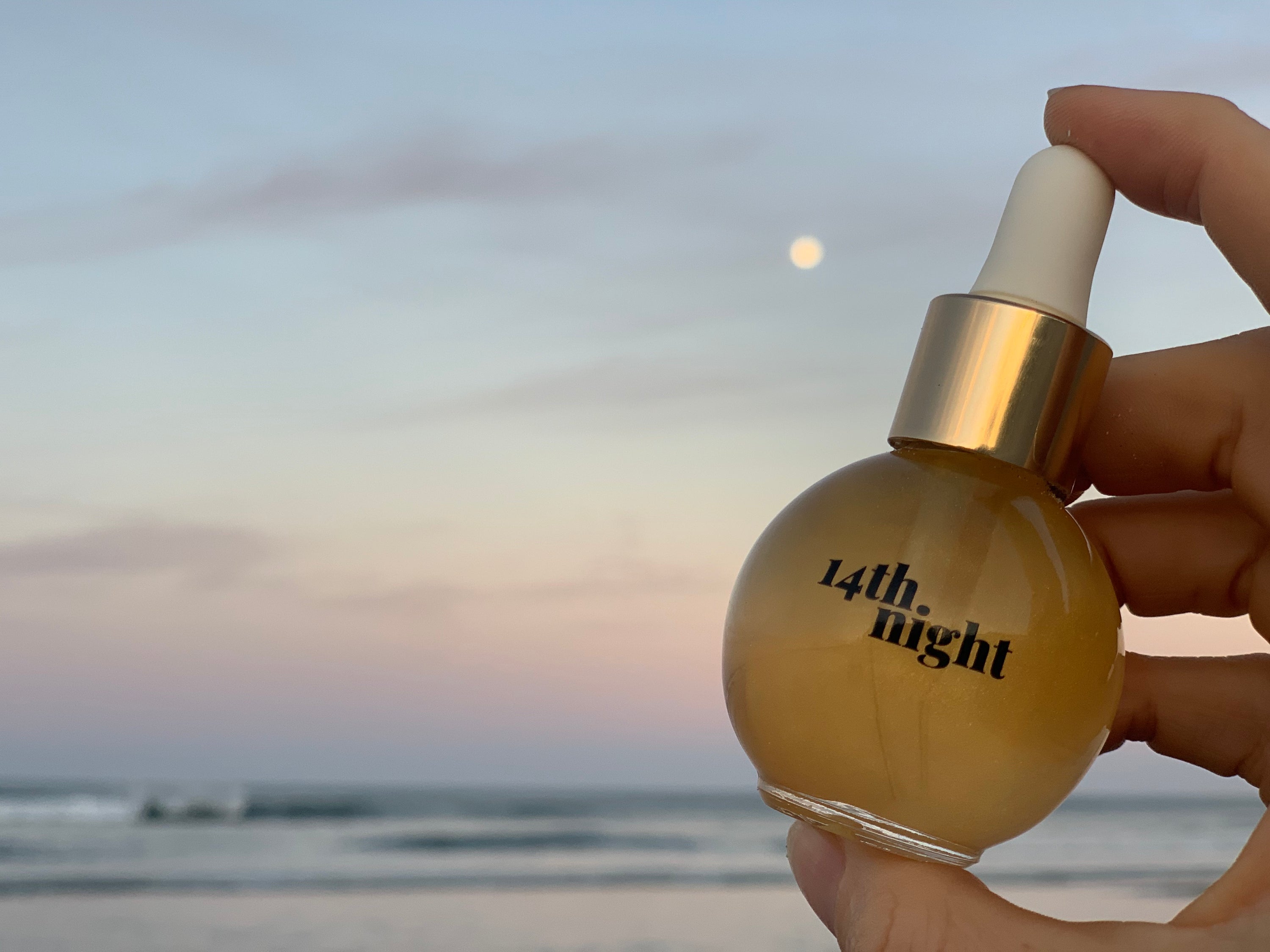 14th Night The Hair Elixir against a sunsetting sky